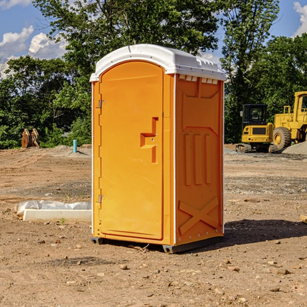 what is the cost difference between standard and deluxe portable toilet rentals in Bloomsdale